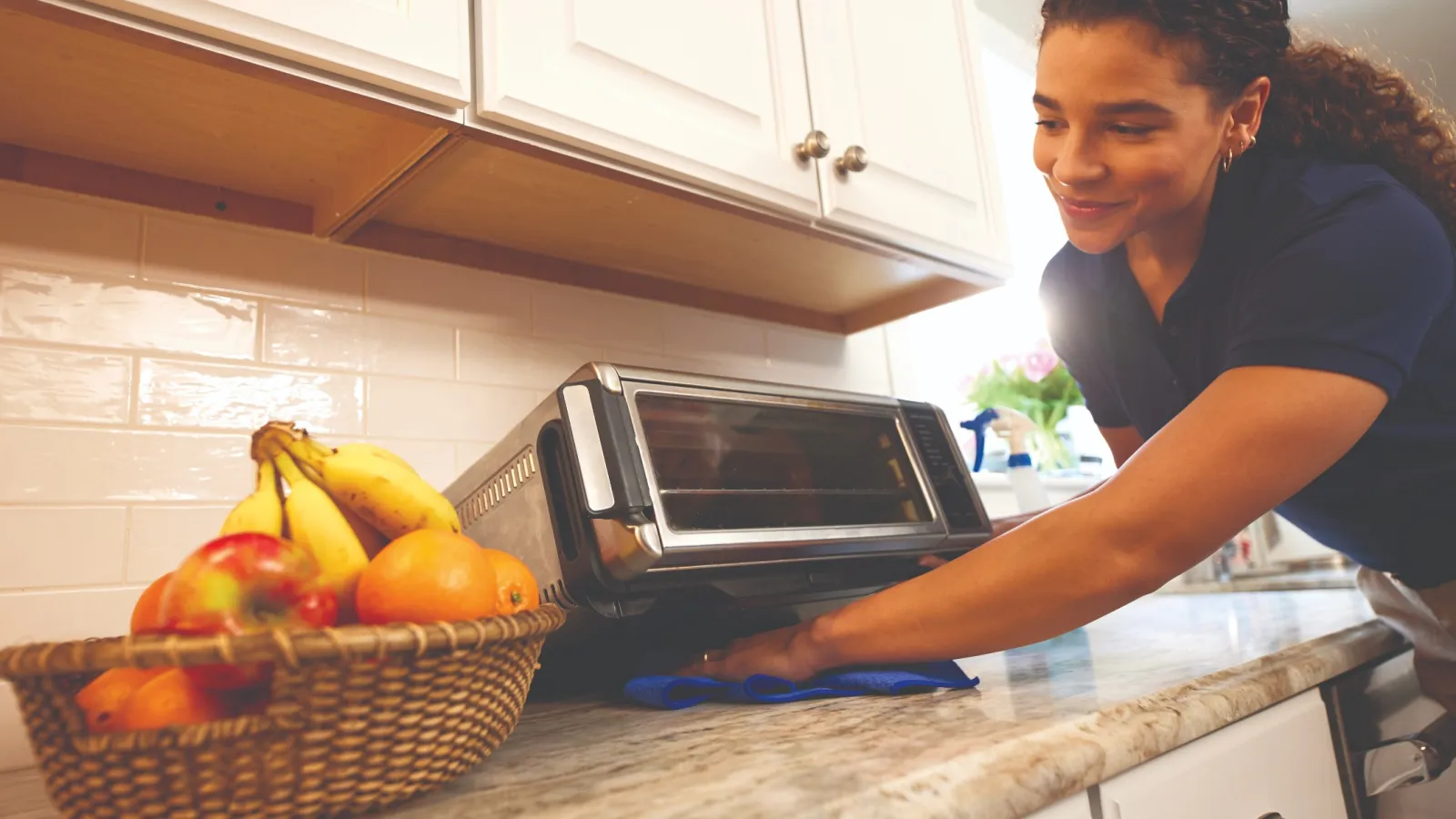 professional cleaner wiping countertops