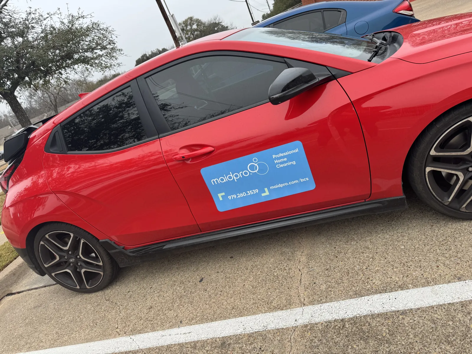 a red car parked in a parking lot