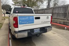 Thumbnail for a white truck with a blue sign