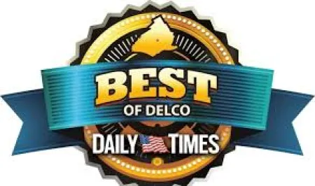 Best of Delco award badge by Daily Times with blue ribbon and gold accents.