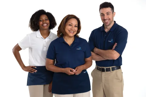a group of MaidPro cleaners posing for a photo