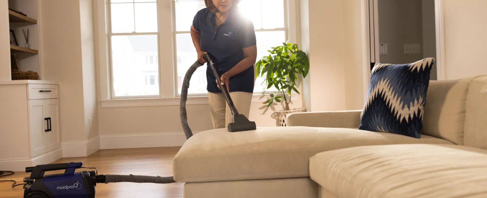 a person vacuuming a living room