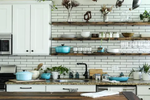 a kitchen with white cabinets