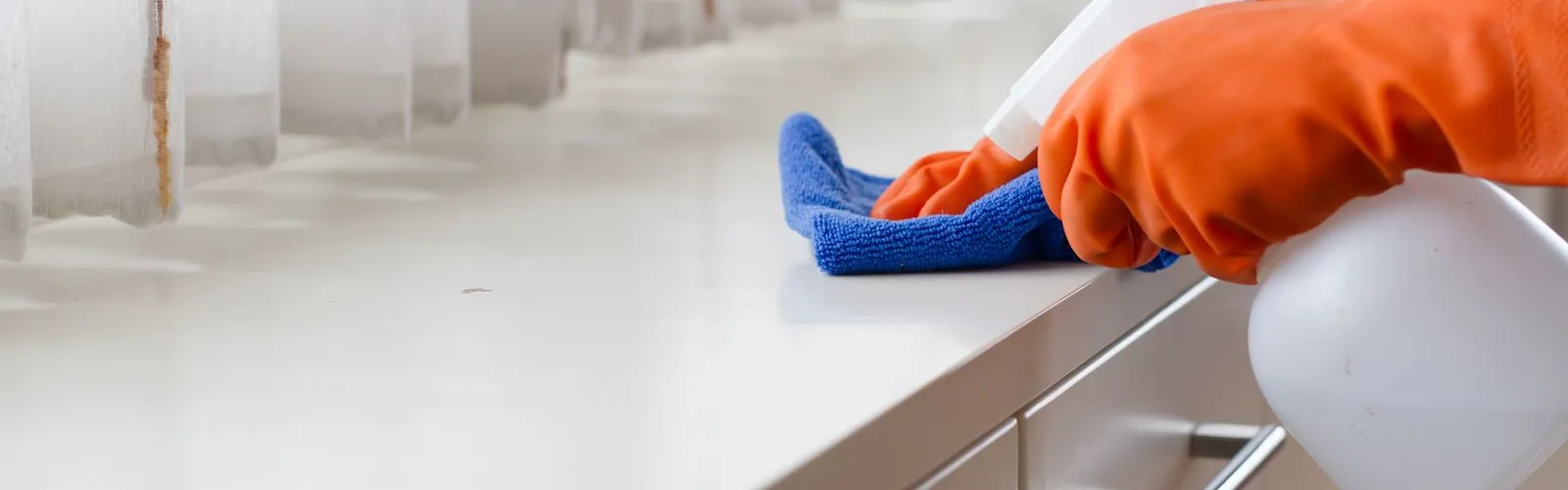 a person in a blue and orange garment on a white counter