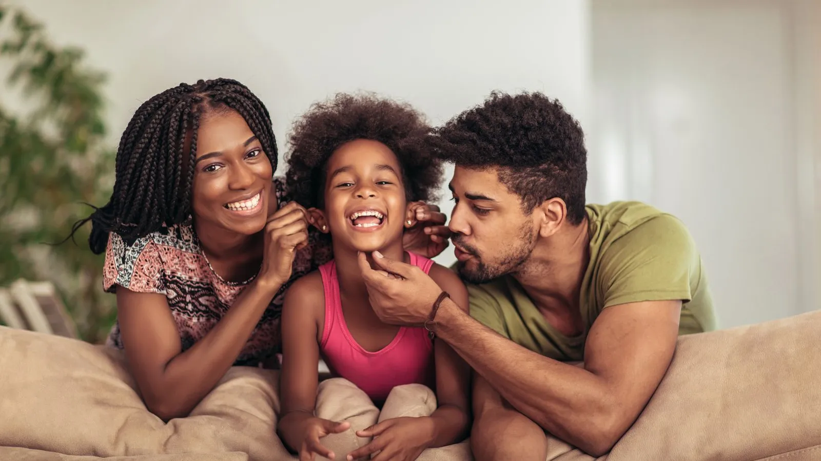 a family sitting on a couch