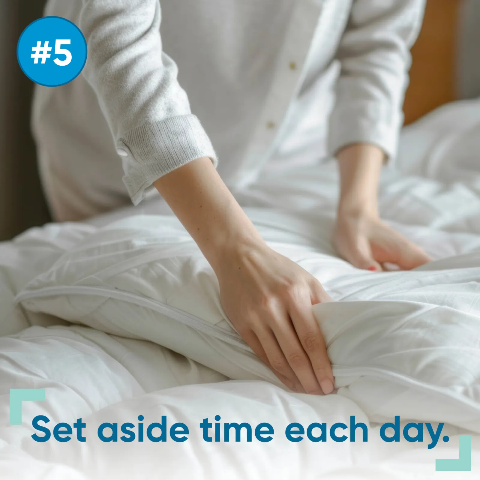 person making bed