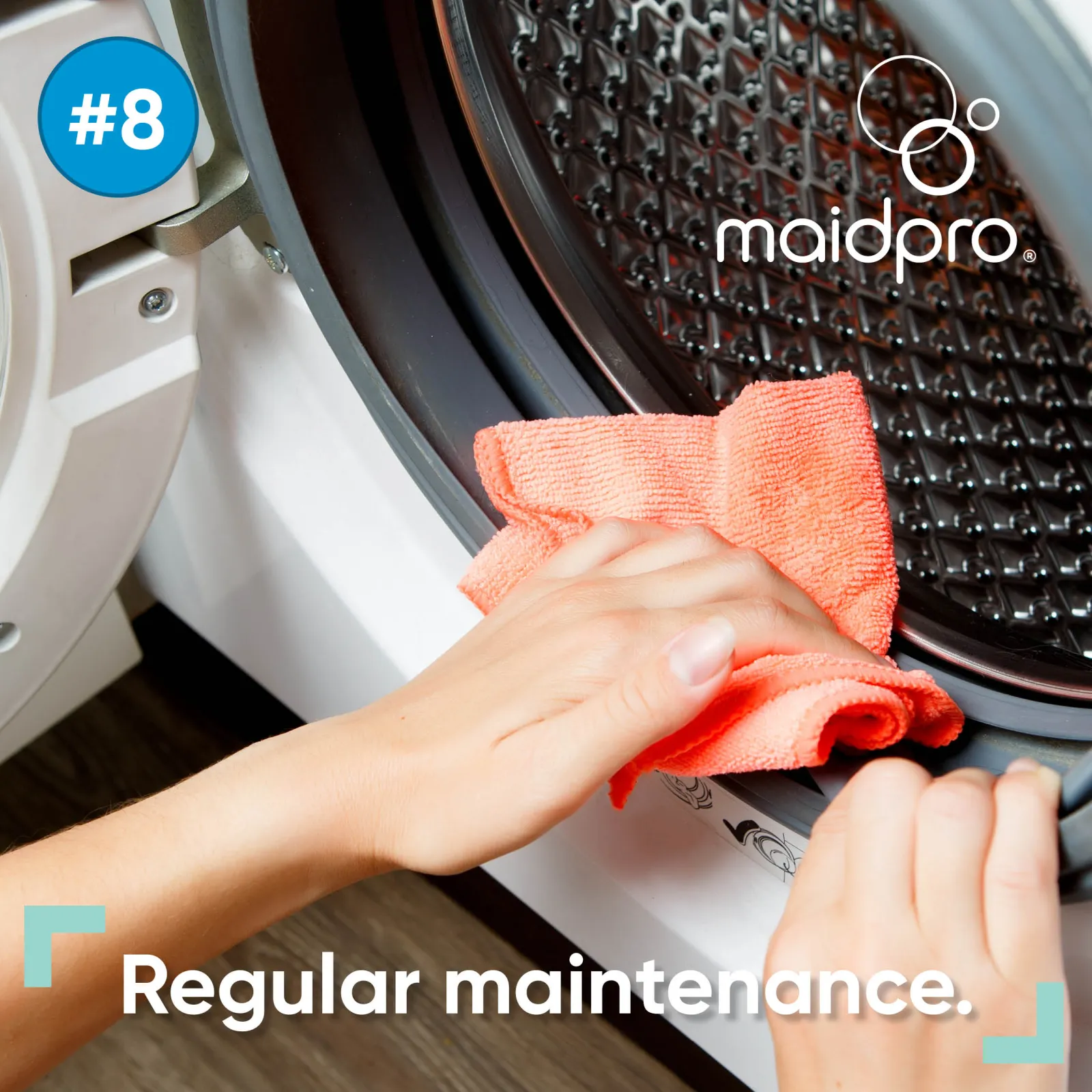 person wiping inside of washing machine with rag