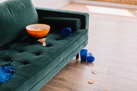 a bowl of food on a green couch