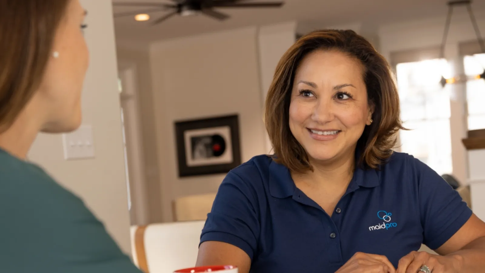 a woman smiling at another person