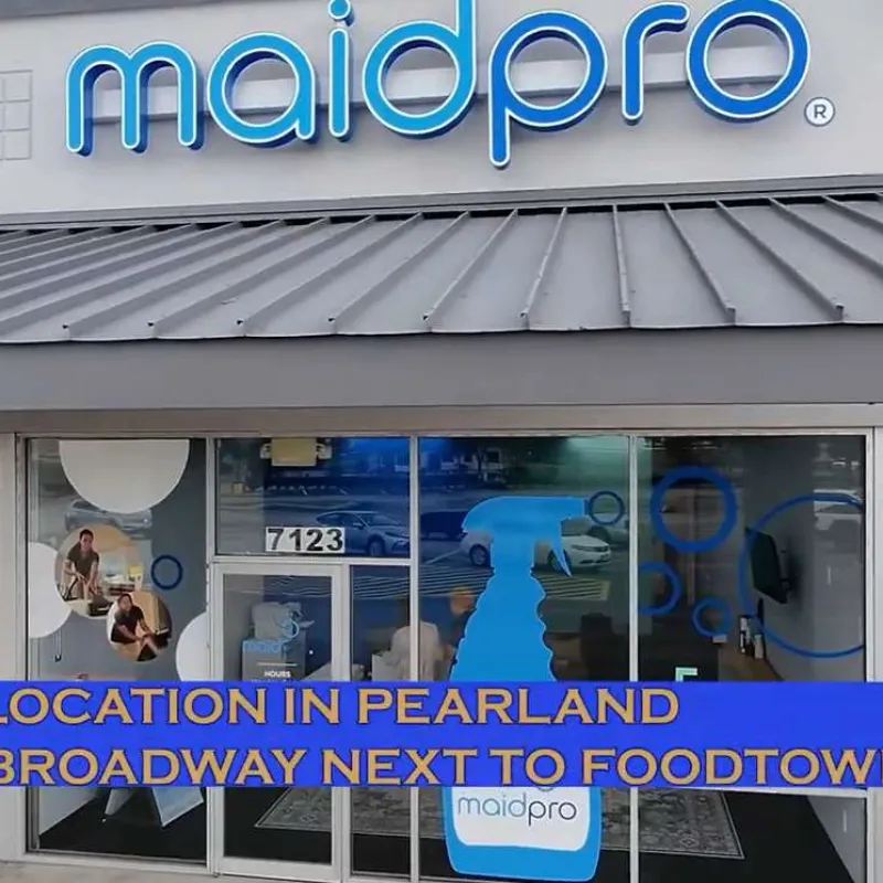 MaidPro storefront with signage announcing new Pearland location at 7123 Broadway next to Foodtown.